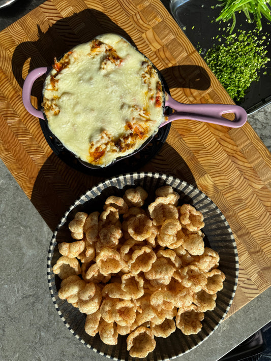 Baked cream cheese crab dip with a golden Marinara Tantos crust