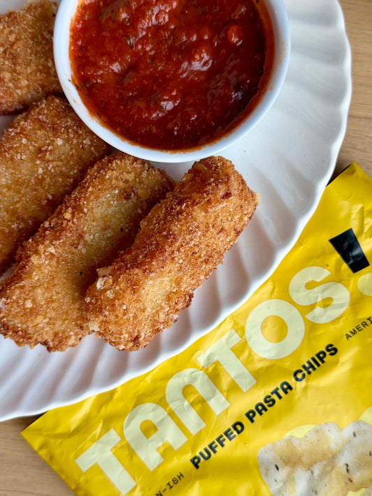 Cacio e Pepe Mozzarella Sticks breaded with crushed Cacio e Pepe Tantos
