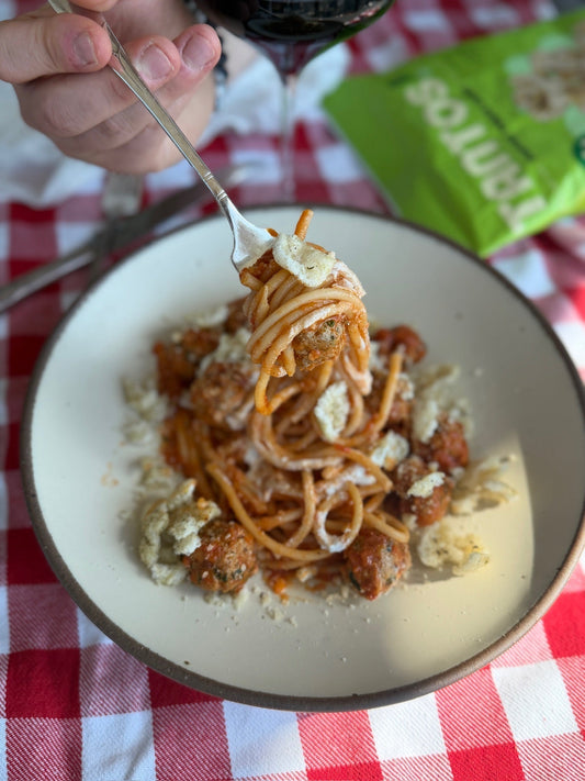 Spaghetti and meatballs topped with crushed Pesto Tantos